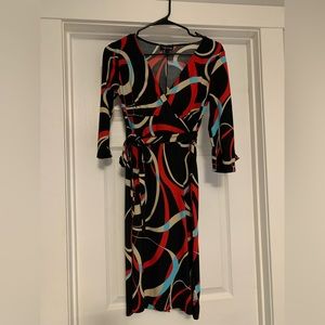 Women’s colorful fun design dress size small with v neck and waist tie.